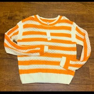 Orange and white open knit sweater
